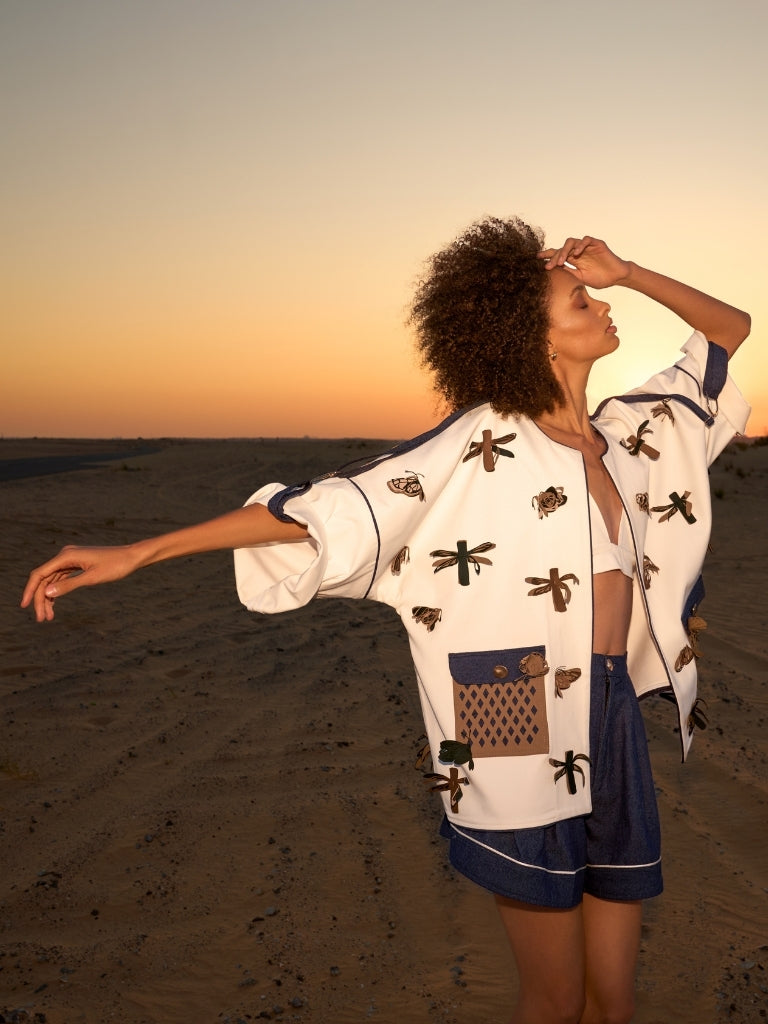 Off-white coat with colored drogonfly and butterfly